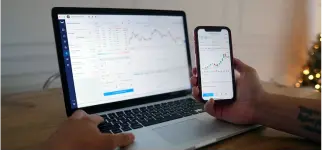 Laptop and Iphone on a desktop with bruno app open